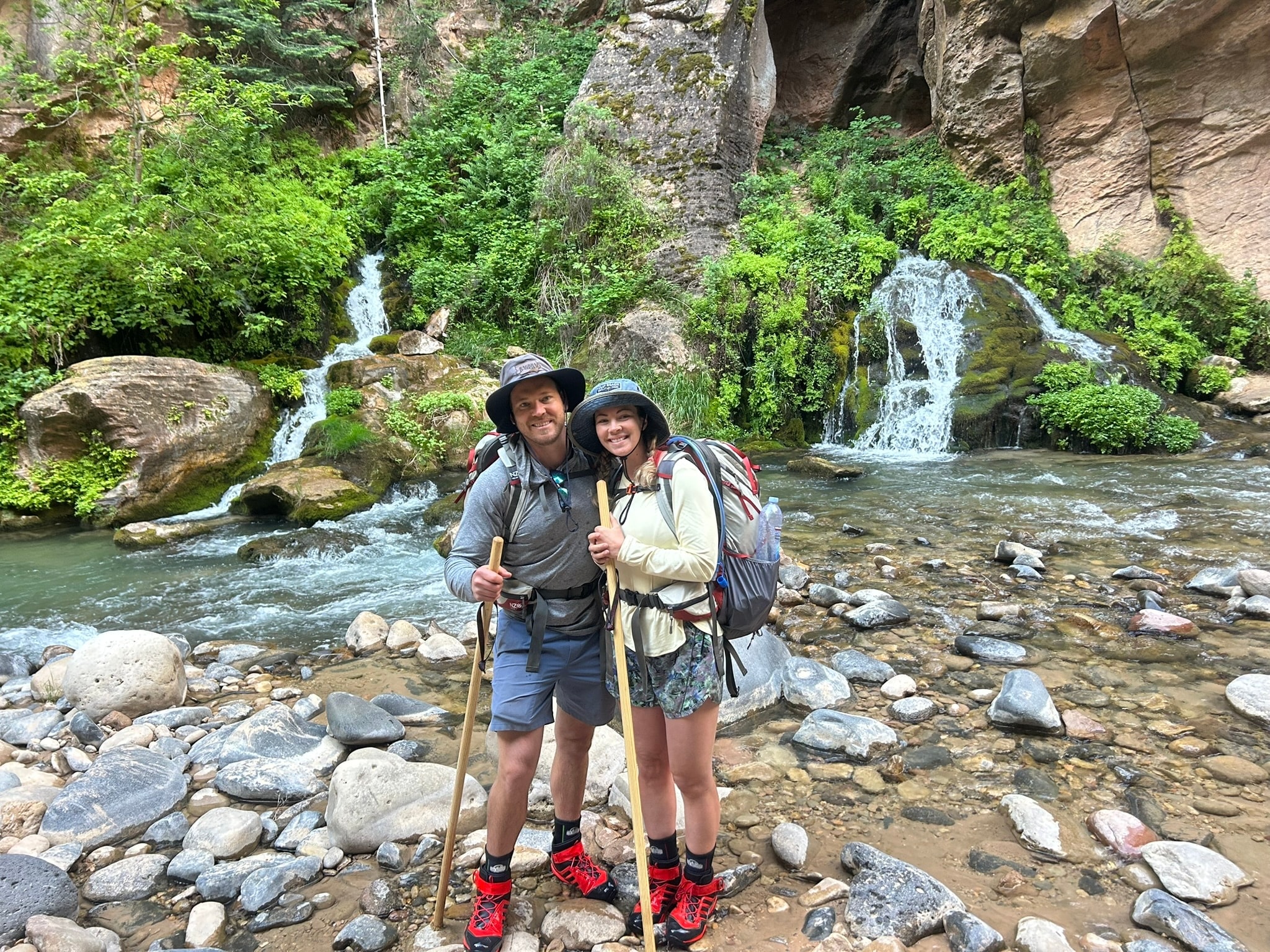 Group of EPIC90 members hiking together on a canyon trail