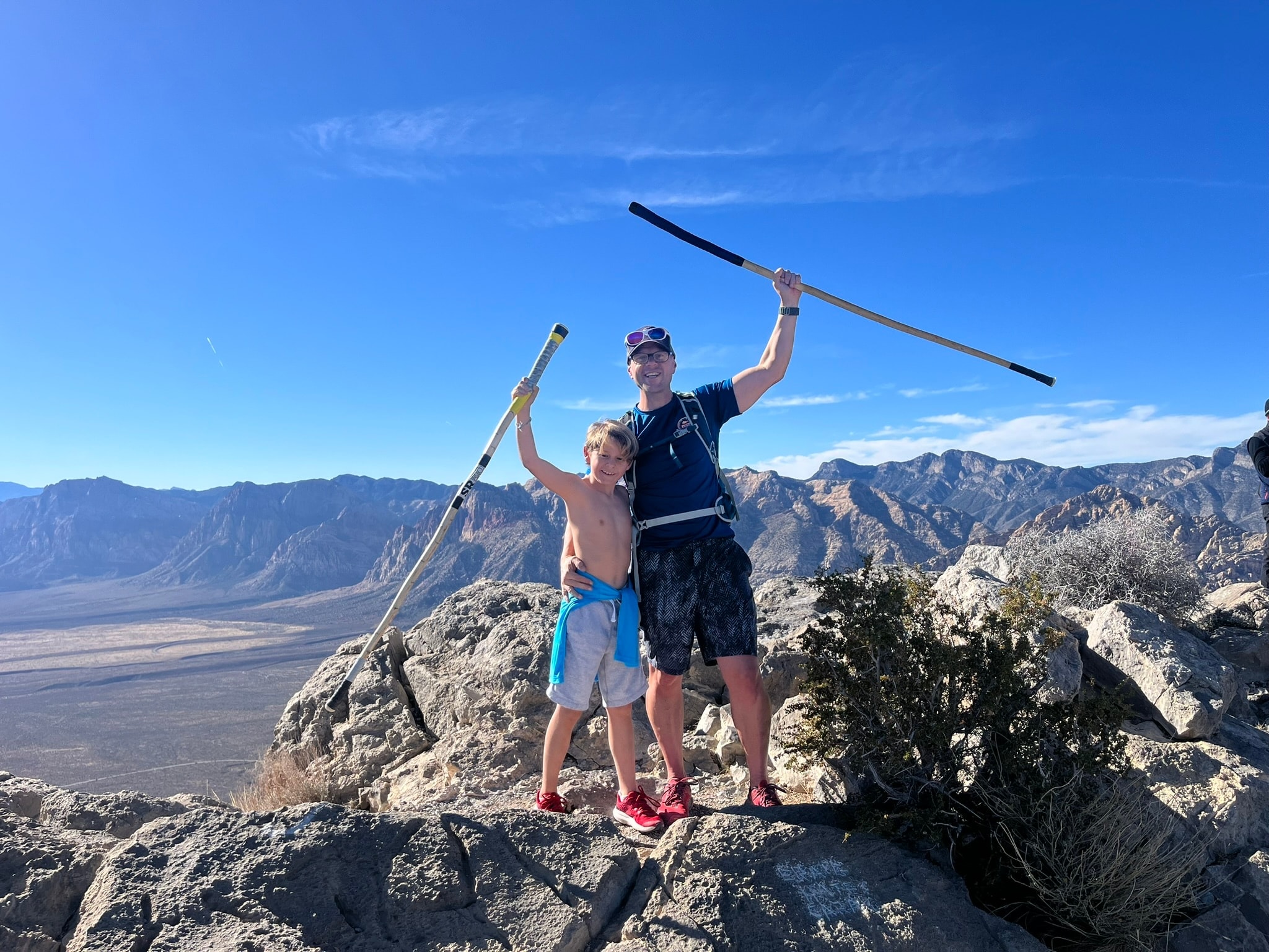 Father and son hiking together on a wilderness trail